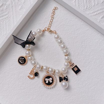 Black 4-PCS Pearl Charm Pet Necklace - Adjustable Bowknot Collar for Small Dogs & Cats (S: 20+5CM) - view 4